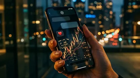A hand holding a phone with a heart symbol and reflected financial charts